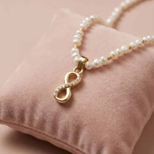 Collier perles d'eau douce جوهر حر, pendentif infini en acier inoxydable et détails en plaqué or, ajustable au Maroc.