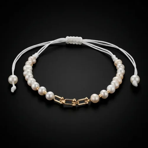 Bracelet ajustable sur cordon blanc avec maillon central style Tiffany en or massif 18k et perles d'eau douce جوهر حر au Maroc.